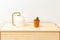 Cactus and watering can on a wooden shelf. Plant home decoration. Minimal