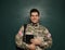 Cadet with backpack and tablet near chalkboard. Military education