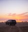 Cadillac Escalade on sunset beach