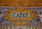 Cadiz sign over a mosaic wall