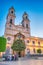 Cadiz, Spain - April 8, 2023: Tourists along Iglesia de San Antonio at sunset