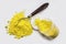 Cadmium Yellow pigment on a white background