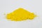 Cadmium Yellow pigment on a white background