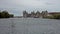 Caernafon Castle at high tide with lots of boats at their moorings