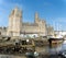 Caernarfon Castle and River Seiont at low tide,in late afternoon sun,North Wales,United Kingdom