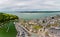 CAERNARFON, UK - AUGUST 31 2022: Aerial view of the ancient Caernarfon Castle in North Wales.  The castle is currently undergoing