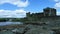 Caerphilly Castle and ruins with moat and landscpae.