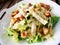 Caesar salad with chicken with biscuits on wooden table at Coffee shop and restaurant