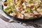 Caesar salad with grilled chicken close-up, horizontal
