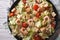 Caesar salad with shrimps horizontal top view closeup