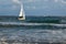 Caesarea, Israel - December 01,2019. People sail on the small sailing boat on the stormy sea