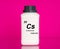 Caesium Cs chemical element in a laboratory plastic container