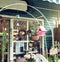 Cafe with birdhouse nestles,glass bottle,flower