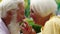 At the cafe closeup to the camera portrait charismatic old man and attractive old woman holding hands and looking in