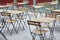 Cafe empty sidewalk wooden tables with chairs