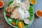 Cafe with food in Indian style. Rice and spicy vegetables, on palm leaf for dinner. Asian food still-life