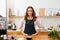 Cafe. Portrait Of Female Barista Working In Coffee Shop