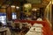 The Cafe Procope interior in Paris with portraits of famous writers and revolutionnary politicians Benjamin Franklin, Jean Jacques