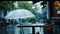 a cafe during a rainy day through a high-quality, full-frame photo of a white umbrella, creating a compelling visual