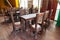 Cafe or restaurant interior in vintage style with colored old things  wooden table and chairs . Interior design