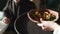 Cafe scene of waitress bringing order to table with business coworkers. Mask wearing girl putting dish on table