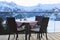 Cafe terrace in the mountains, and view of the Hohe Tauern mountain range. Austria.