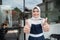 Cafe veiled waitress standing with thumbs up