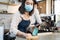 Cafe waiter wear mask, clean restaurant with sanitizer to open store. Asian attractive young couple disinfecting, wiping and