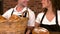 Cafe workers showing baskets of bread