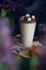 Caffe latte on dark moody background with flowers