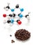 Caffeine molecule with coffee beans