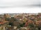 Cagliari\'s skyline with buildings, port, sea and gloomy grey clo