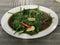 Cah kangkung, kangkong, or water spinach stirred