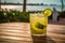 Caipirinha cocktail on a wooden table with a mesmerizing sea, beach background, evoking relaxing, tropical paradise vibe