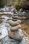 Cairn of balanced stones by the riverside