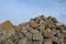 Cairn with big massive limestone rocks piled up at blue sky