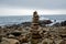 Cairn in front of coastal landscape