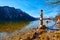 A cairn  human-made pile or stack of stones near Hallstatt lake at sunny day in Austrian Alps