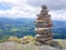 cairn (Inukshuk rocks) at the top of La Rhune mountain in the Atlantic Pyrenees. Border between Spain and France