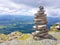 cairn (Inukshuk rocks) at the top of La Rhune mountain in the Atlantic Pyrenees. Border between Spain and France