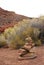 Cairn, pile of stones in red desert