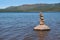 Cairn on a rock in the lake