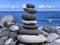 cairn on the shore against the blue sky close-up, balance