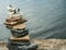 Cairn, stacked stones, on lake shore