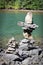 Cairn stacks built along a lake shore in summer