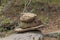 cairn. stone pyramid in the forest along the trail for the landmark of travelers.