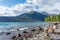 Cairns along the rocky shoreline of mountain lake