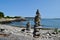 Cairns and rocks along the rocky coastline in Portland Maine