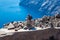 Cairns of rocks at the walking path number 9 between the cities of Fira and Oia at Santorini