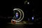 Cairo, Egypt, April 17 2023: A crescent made with led lights with Ramadan Fanous lamp lantern in the street as a festive sign